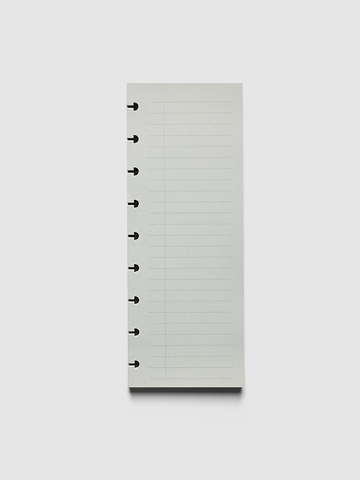 System Punch Pad, HP Classic 9-Disc Punch, pale grey pad of ruled task list sheets lying flat, disc notches along the left edge