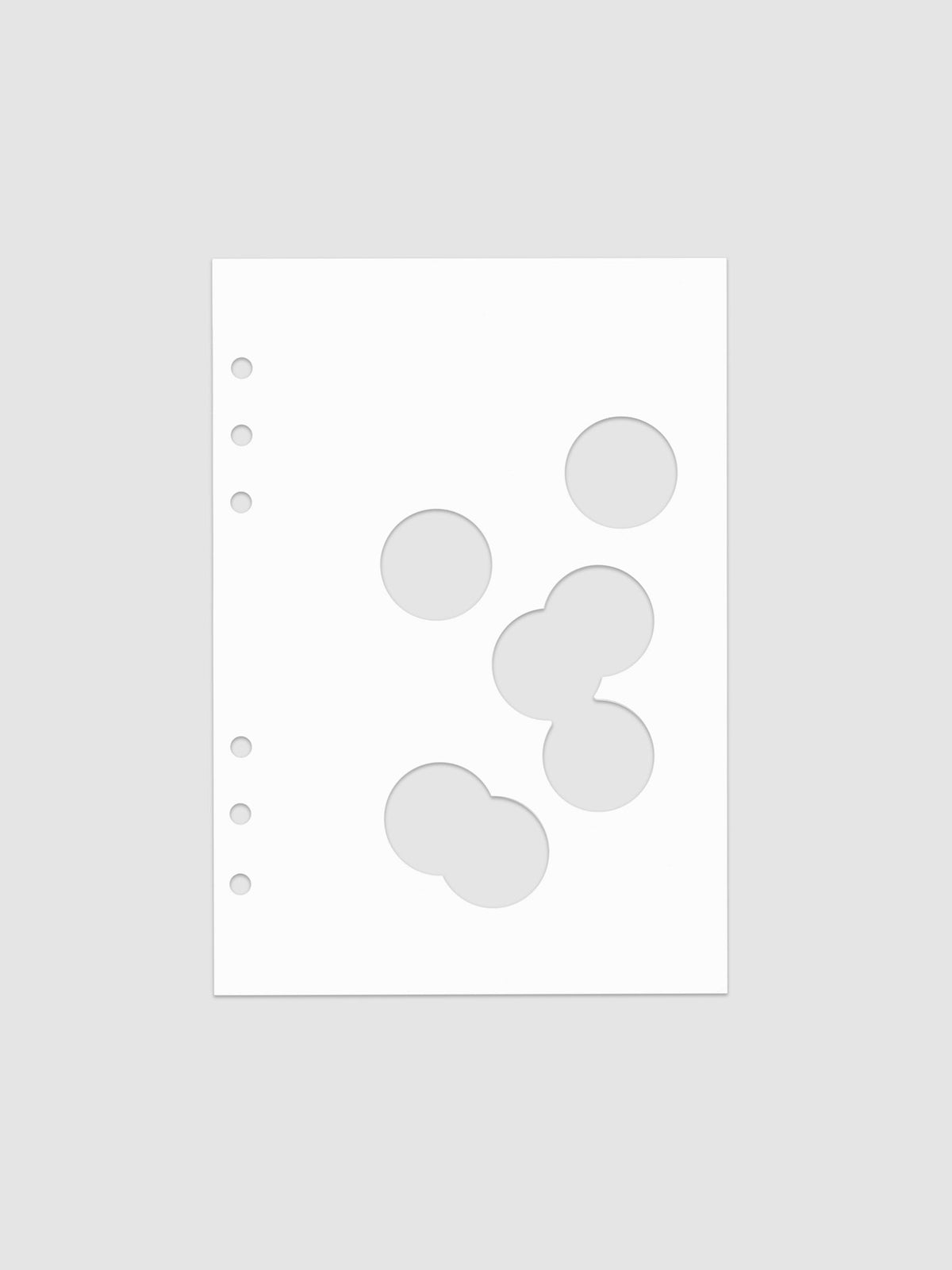 White dashboard from the Ink Blot Planner Dashboard Duo on a neutral background in size A5, pre-punched for 6-ring planners.