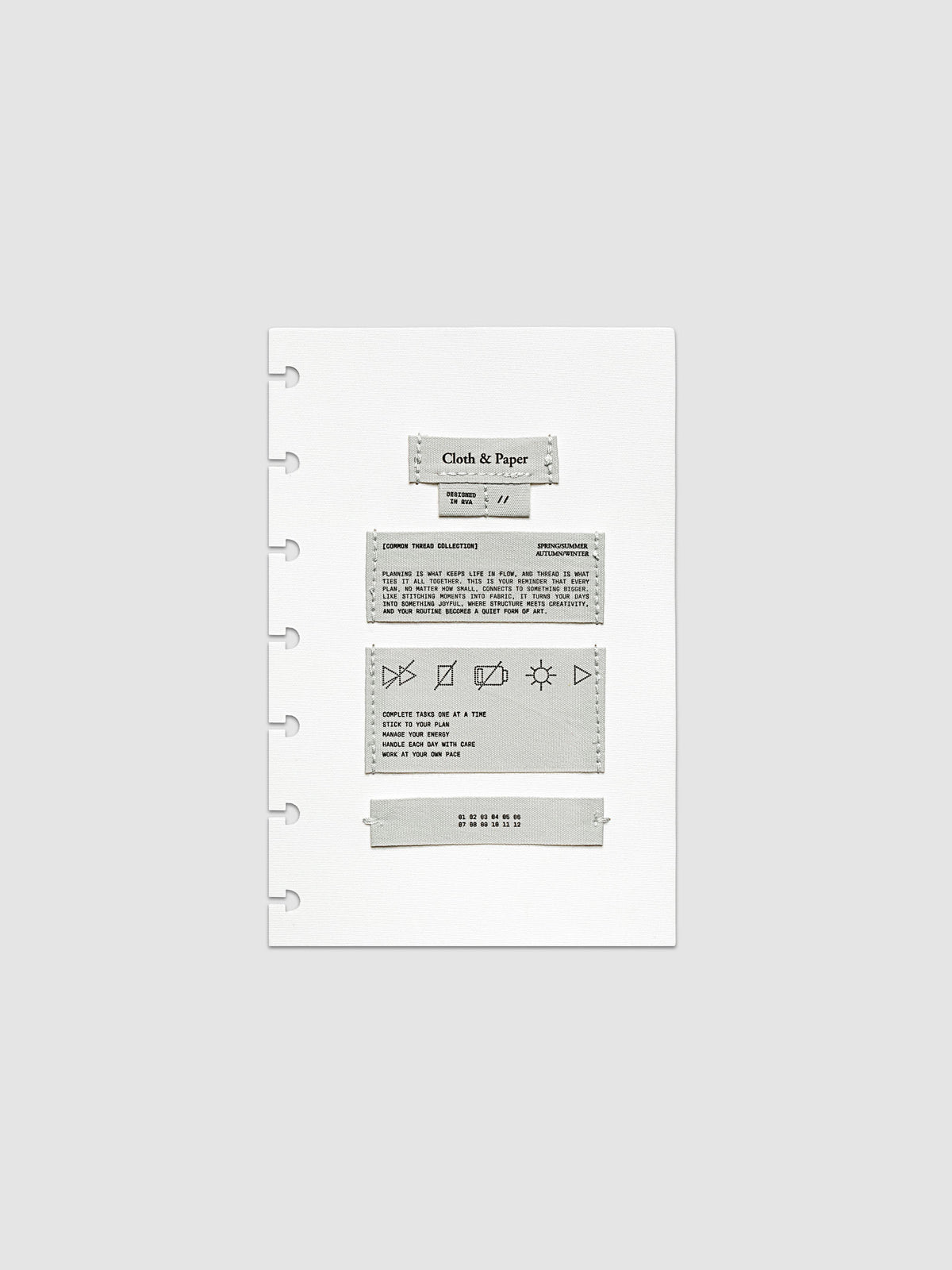 Sewn Tags Planner Dashboard shown pre-punched for discbound planners in size HP Mini.