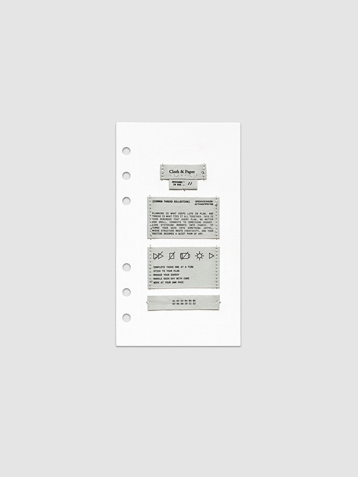 Sewn Tags Planner Dashboard shown pre-punched for 6-ring planners in size Personal.