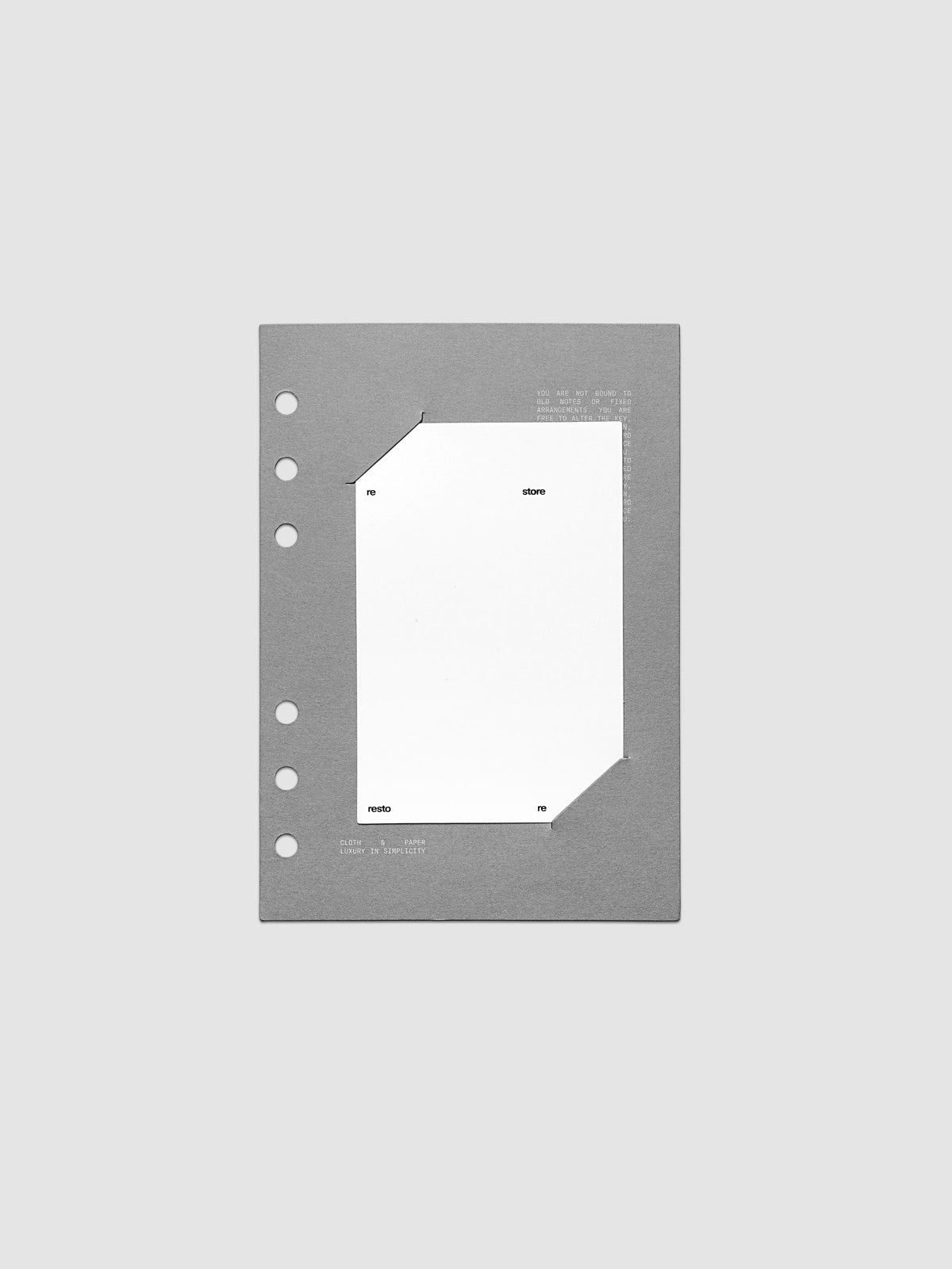 Grey cardstock planner dashboard with white plastic card inserted in slits with white printed text shown in size Personal Wide for ring bound planners.
