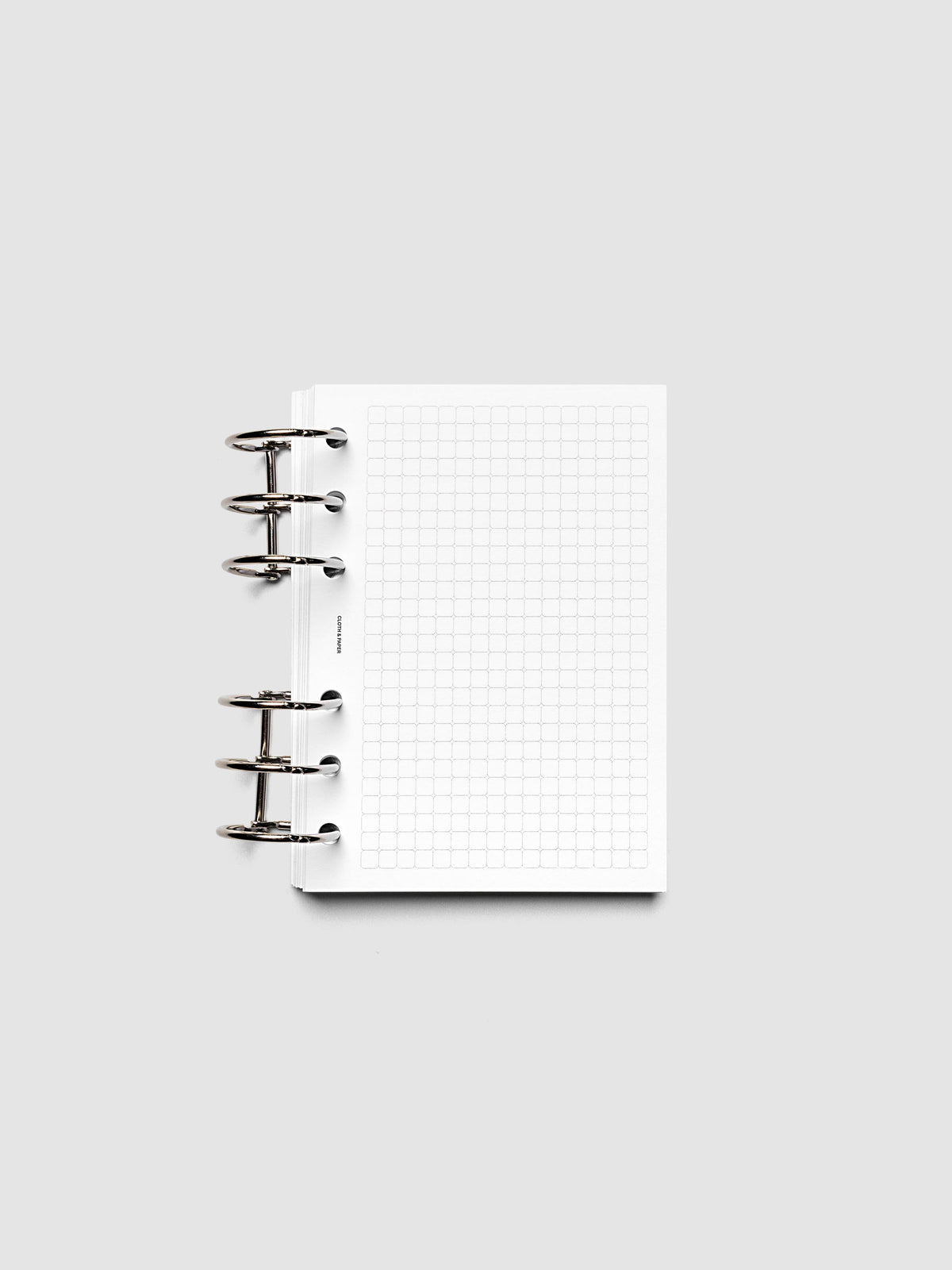 Rounded Graph Planner Insert A6 6-Ring Punch open to an unused grid page