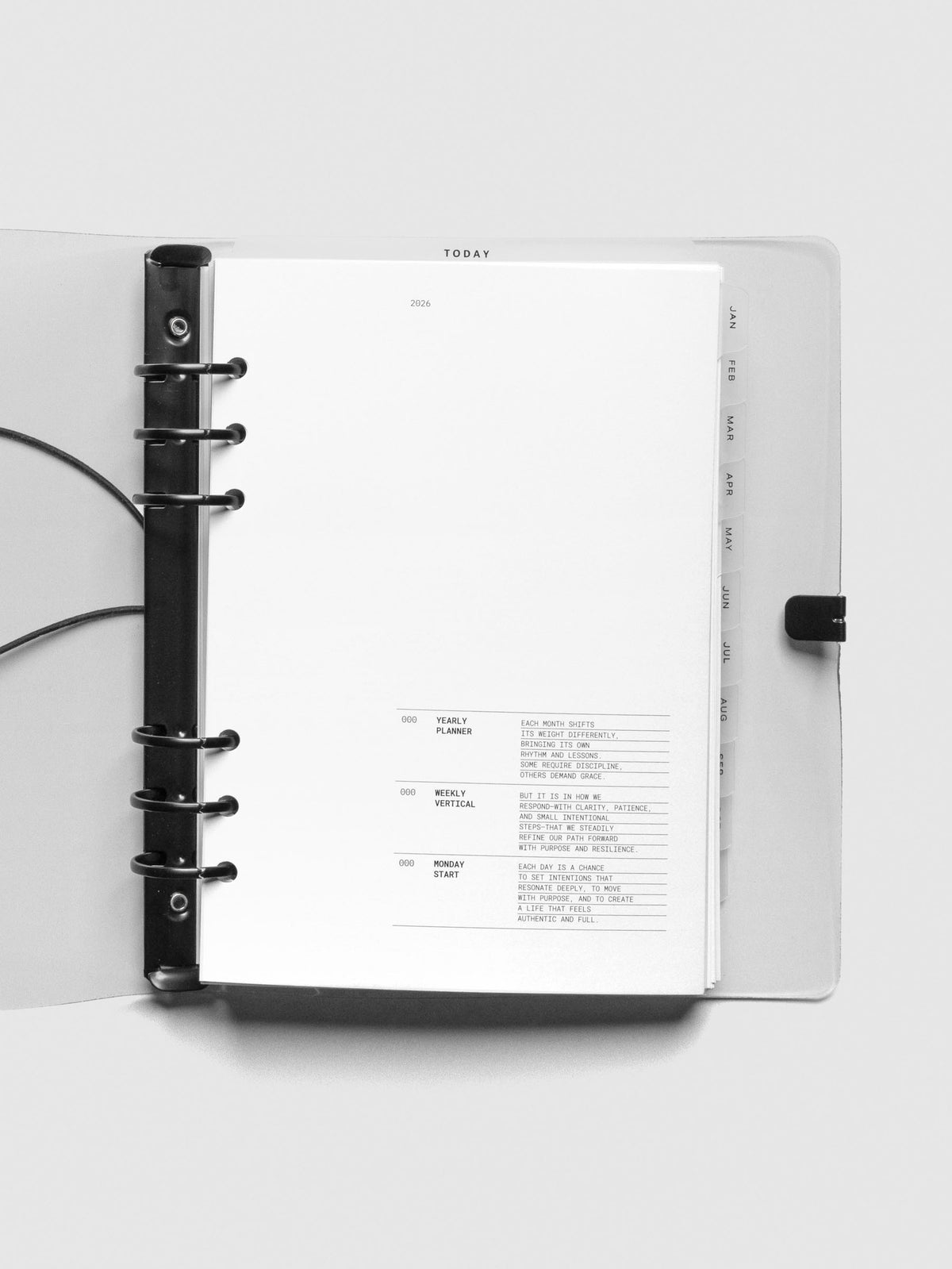 Interior view of open A5 planner showing 2026 insert and tab dividers inside the clear vinyl cover.