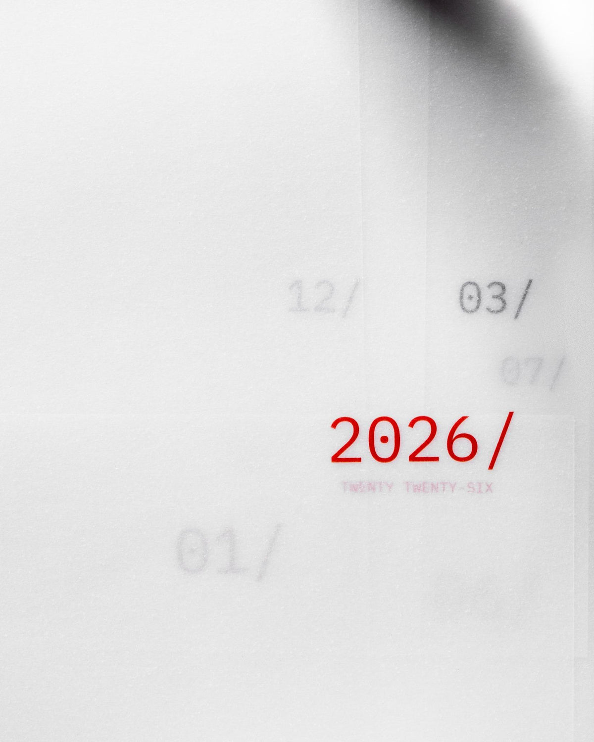 Overlapping vellum dashboards showing multiple months with '2026/' prominently printed in red
