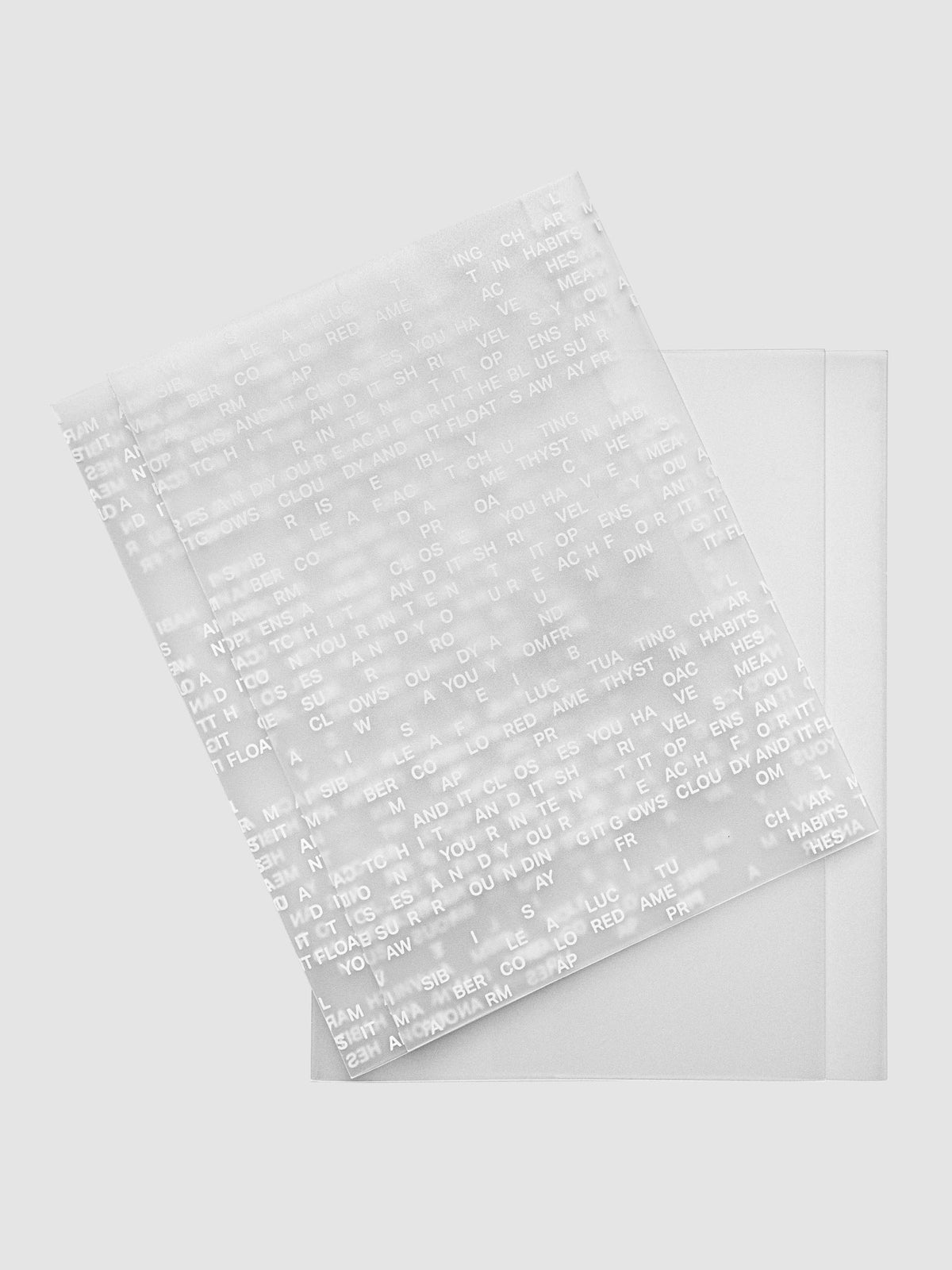 Perfect Bound Notebook Cover Set in size A5 showing Letters cover on top of Le Blanc cover.