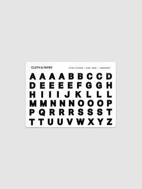 Letter Stickers Transparent, single sheet showing full A–Z alphabet in bold black letters on a clear backing
