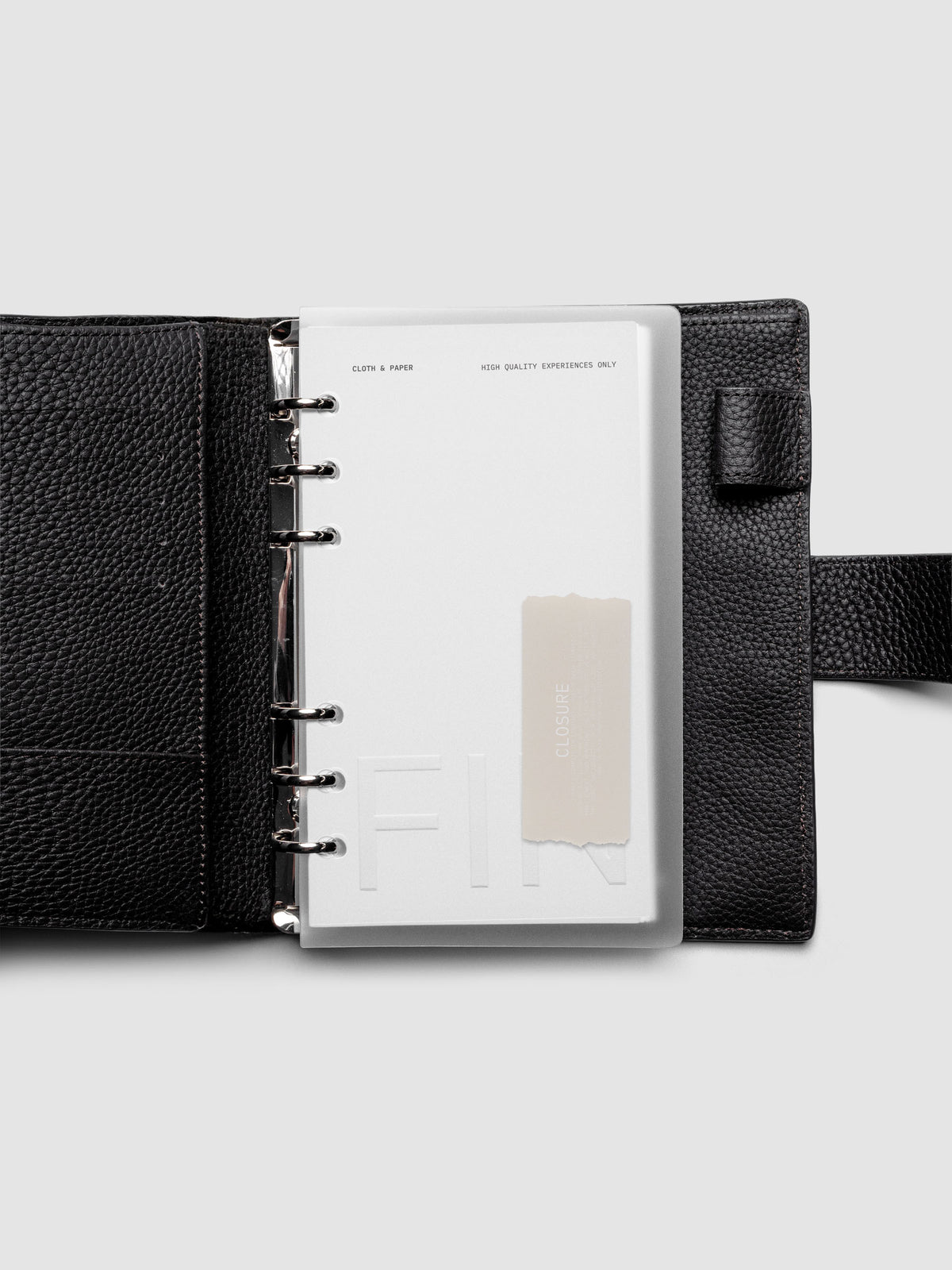 Closure Planner Dashboard + Cover Set in size Personal shown ring bound in a black leather agenda cover.