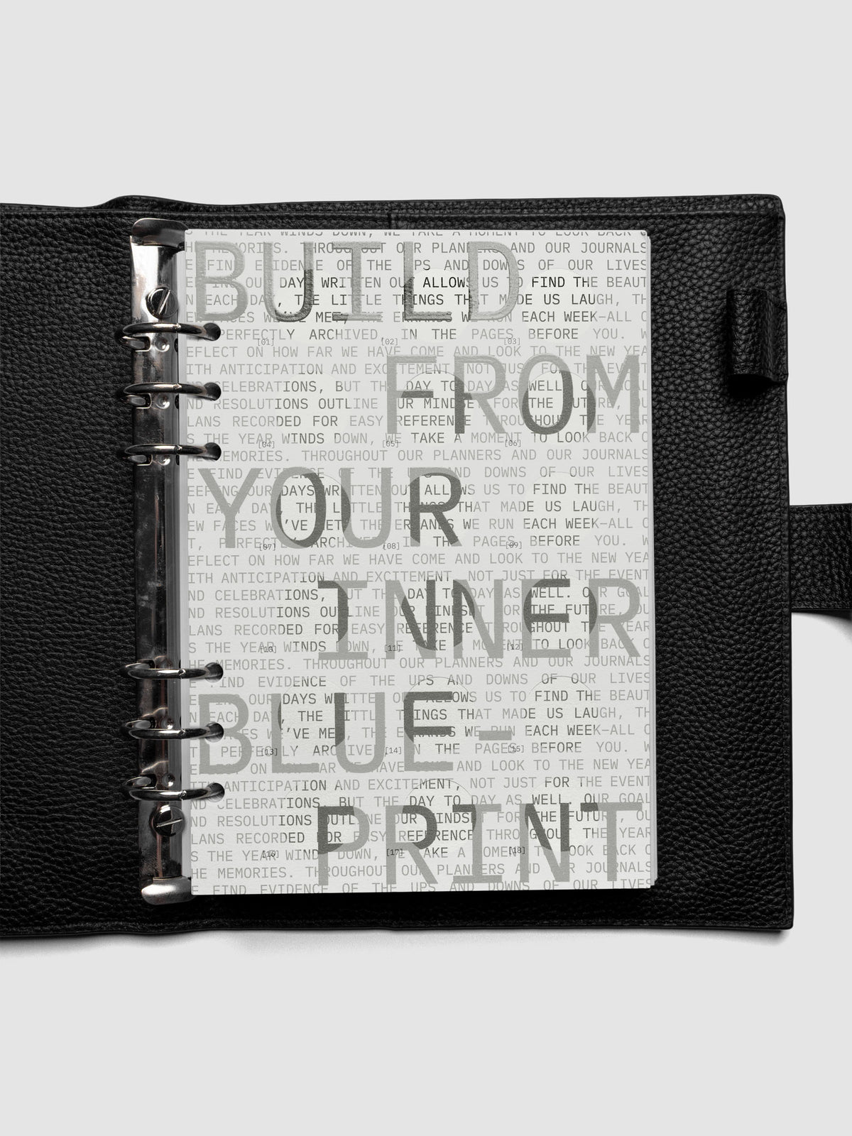 Inner Blueprint Dashboard Duo shown ring bound in a black leather agenda in size A5.