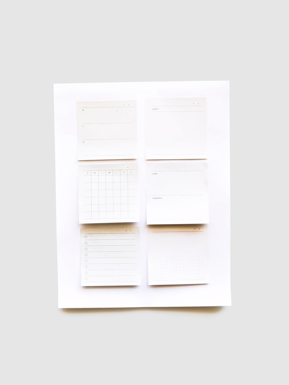 Sticky notes stuck to the printer paper with guides for sticky note placement.