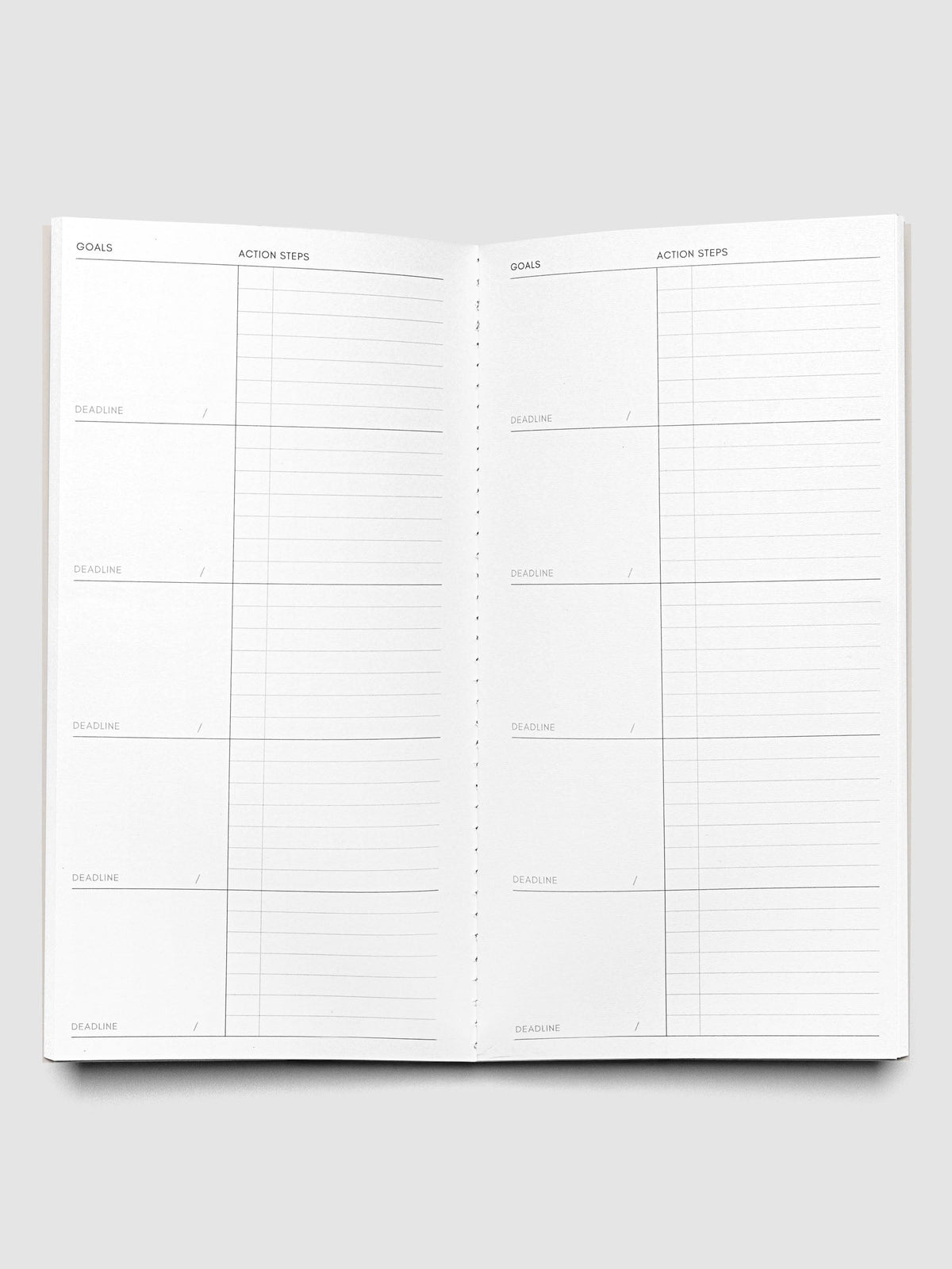 Interior of Travel Notebook in size A5 Slim in color Ibiza with Goal Tracking pages.