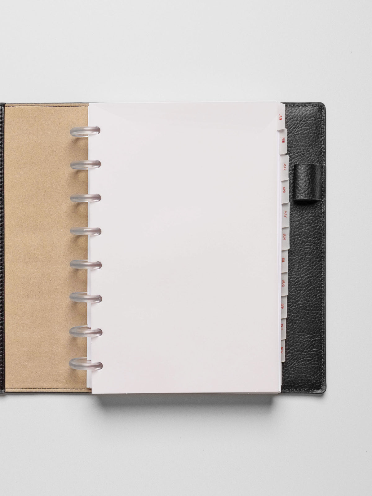 Half Letter vellum dividers shown in a black planner on a neutral background.