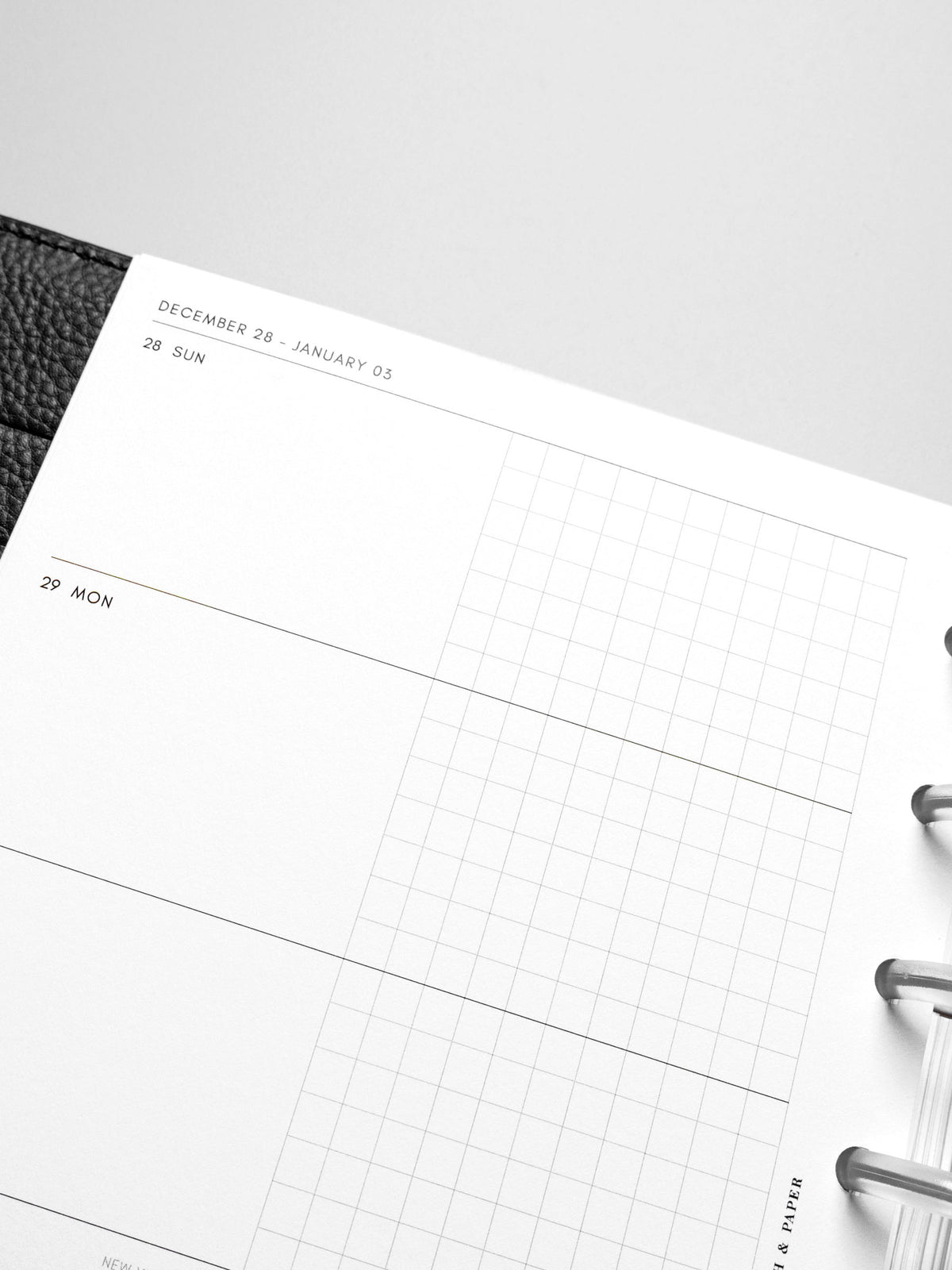 Inserts in use inside a leather planner.