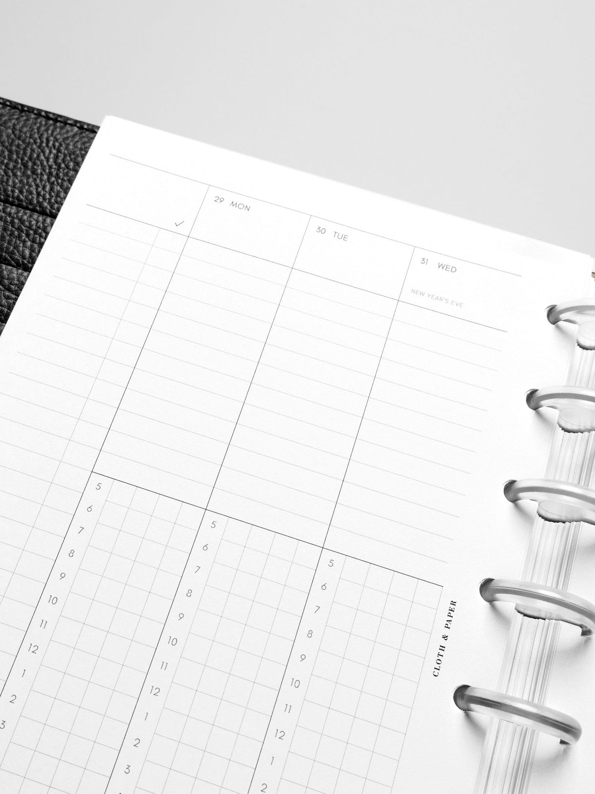Image shows the Monday Start 2026 Dated Weekly Schedule Planner Inserts in a black leather disc-bound planner.