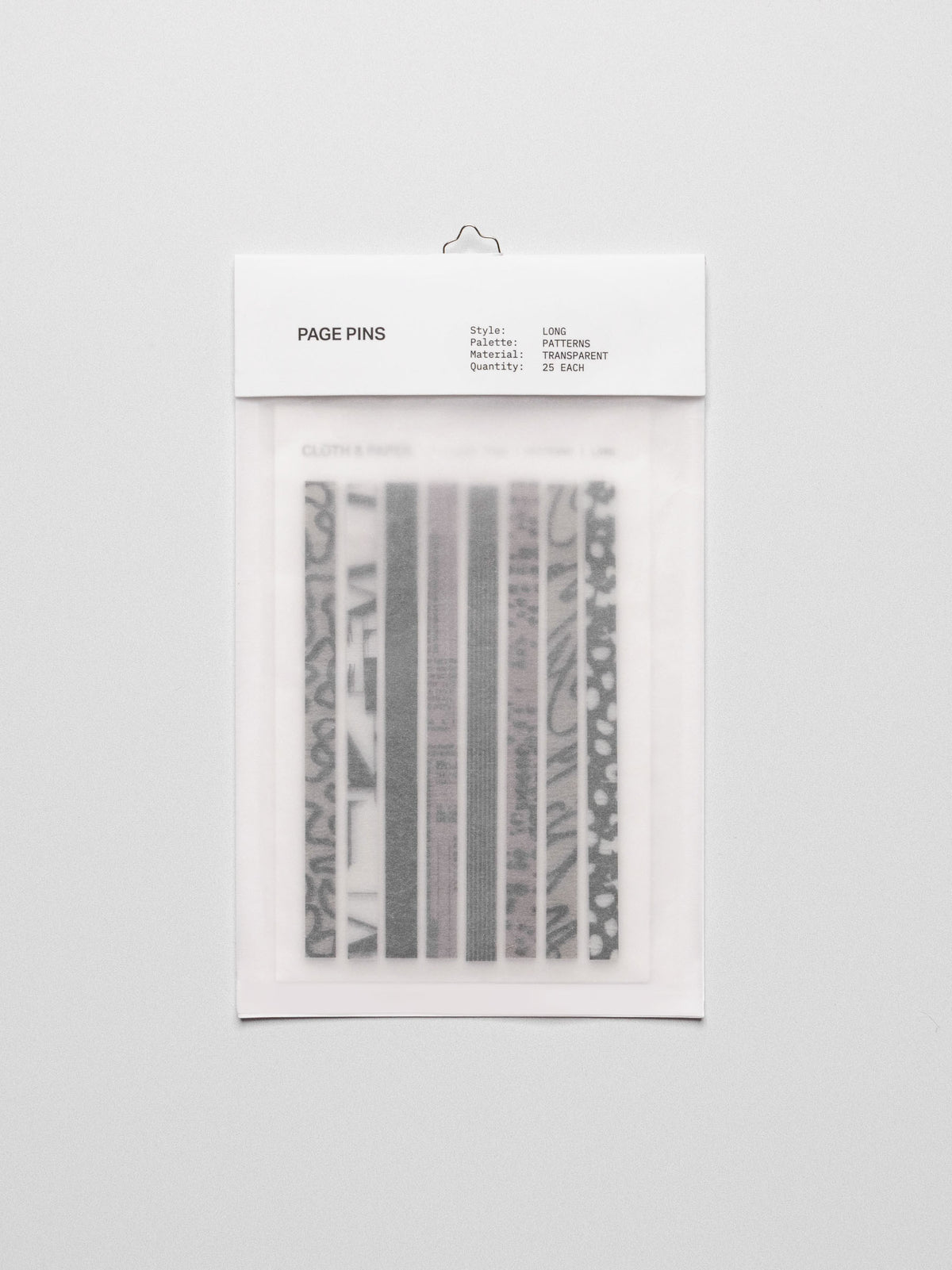 Long page pins displayed in their packaging on a neutral background.