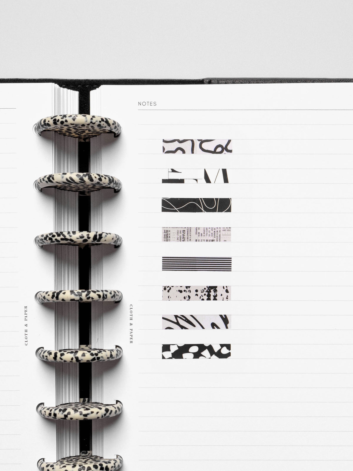 Short page pins displayed inside a discbound planner system.
