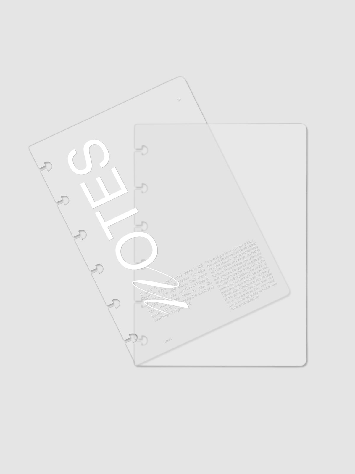 Clear plastic planner cover with white printed text shown pre-punched for CP Petite discbound planners.