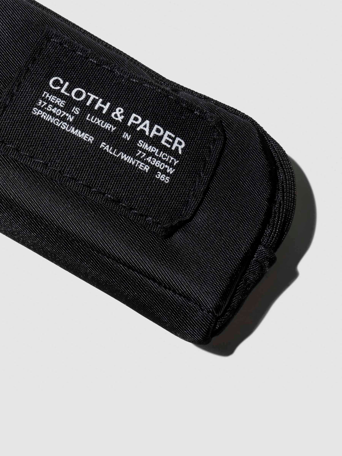 Closeup of Cloth and Paper tag on pouch. Color shown is Avant Garde.