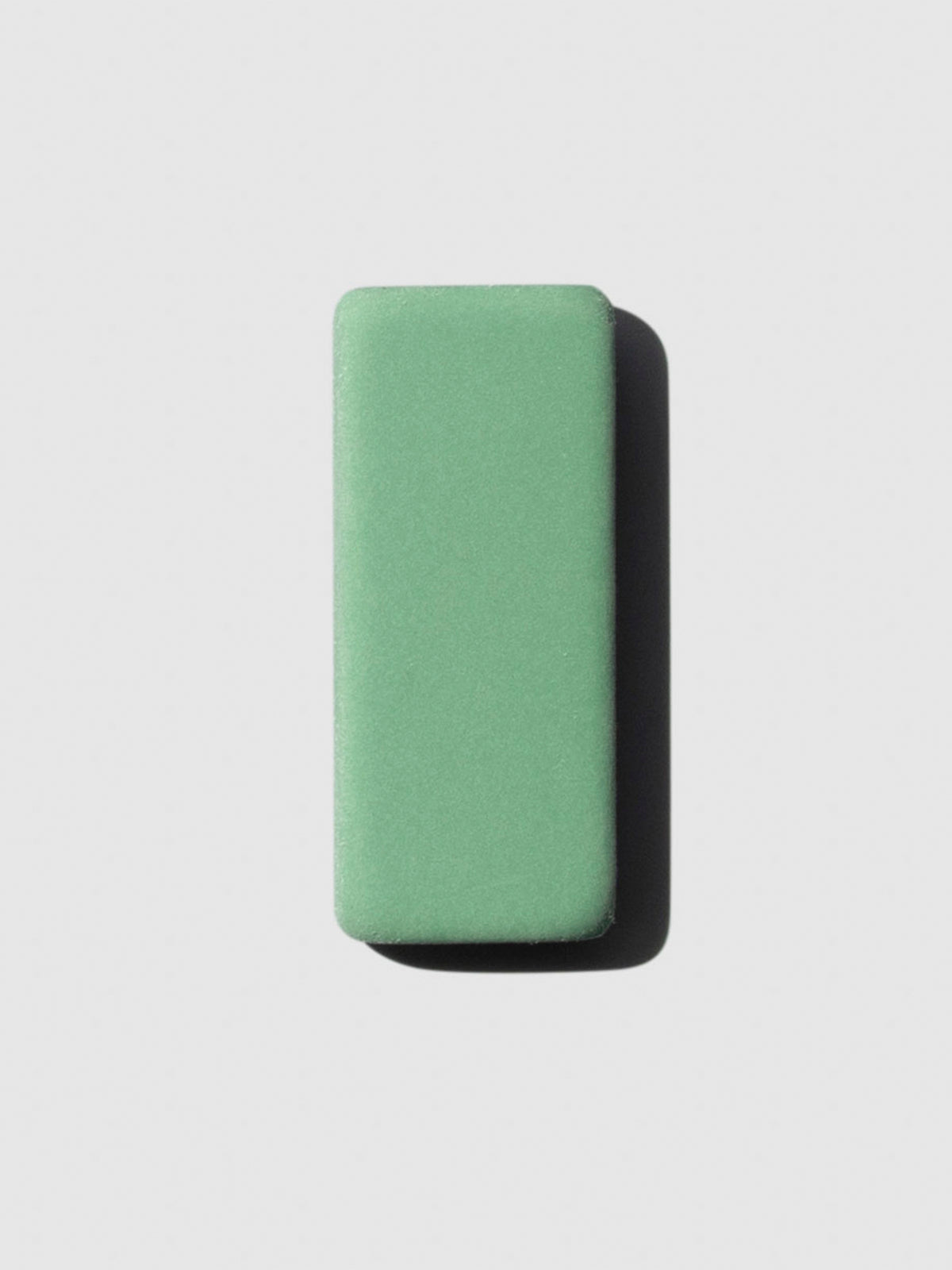 The image shows a close-up of the green color variant of the blackwing replacement eraser.