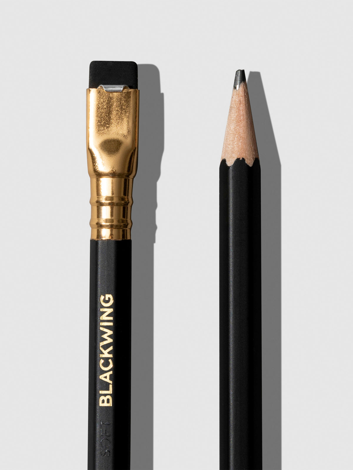 From left to right, the image shows a close-up of the tapered eraser next to a sharpened pencil tip.