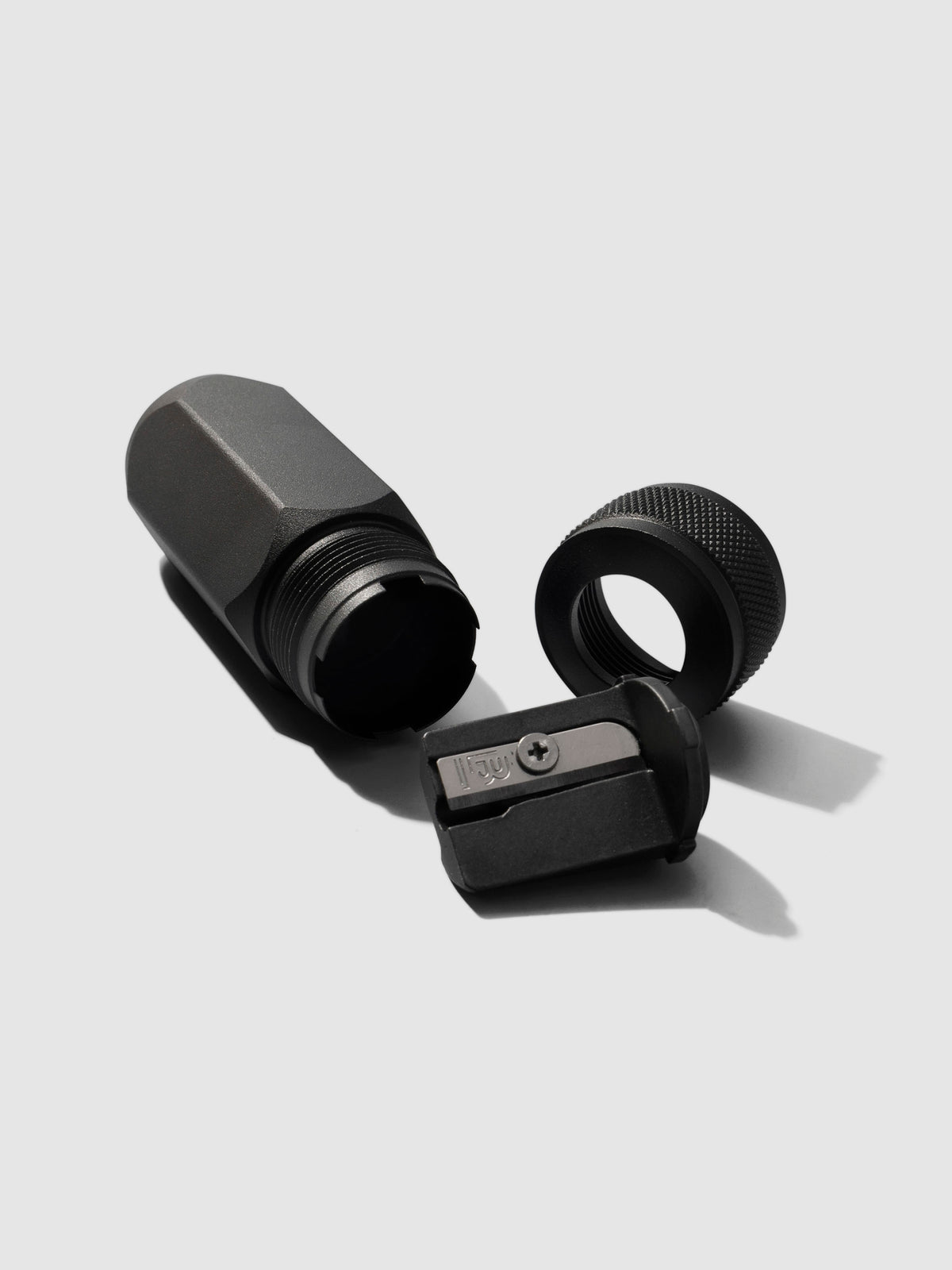 Sharpener shown disassembled on a neutral background.
