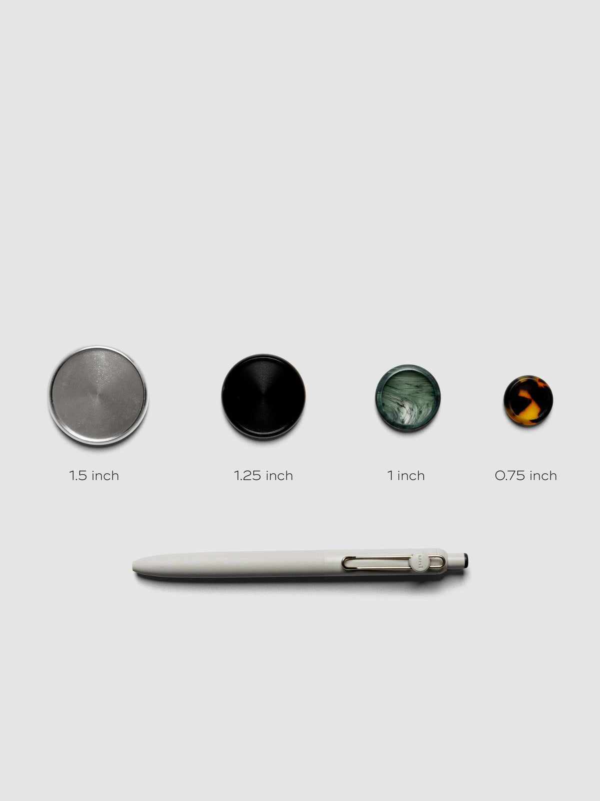 1 each of 1.5 in, 1.25 in, 1 in, and 0.75 in planner discs labeled with a pen below for scale reference.
