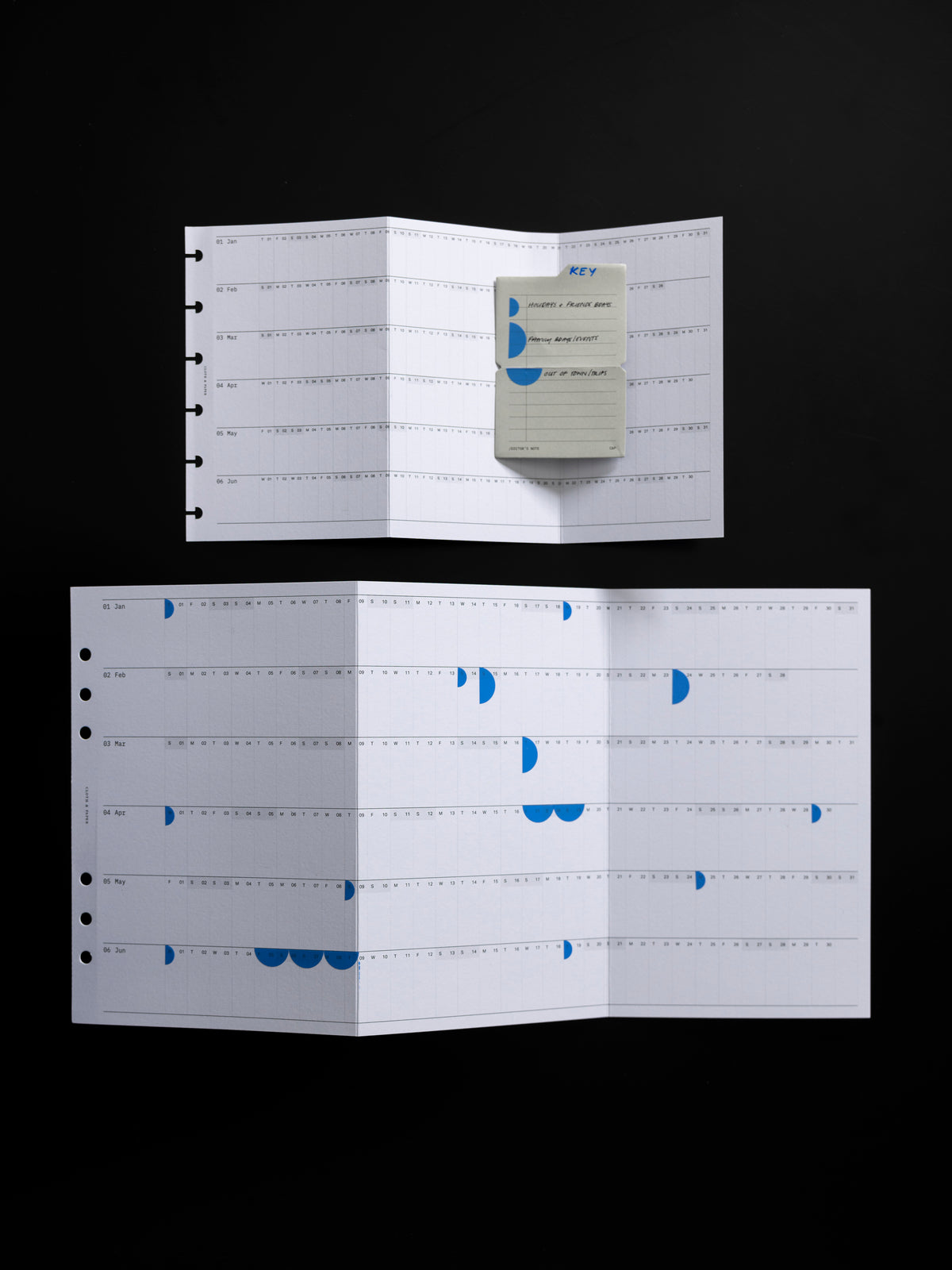 2026 Yearly Fold Out Planner Insert in CP Petite and A5 shown unfolded in use against a black background.