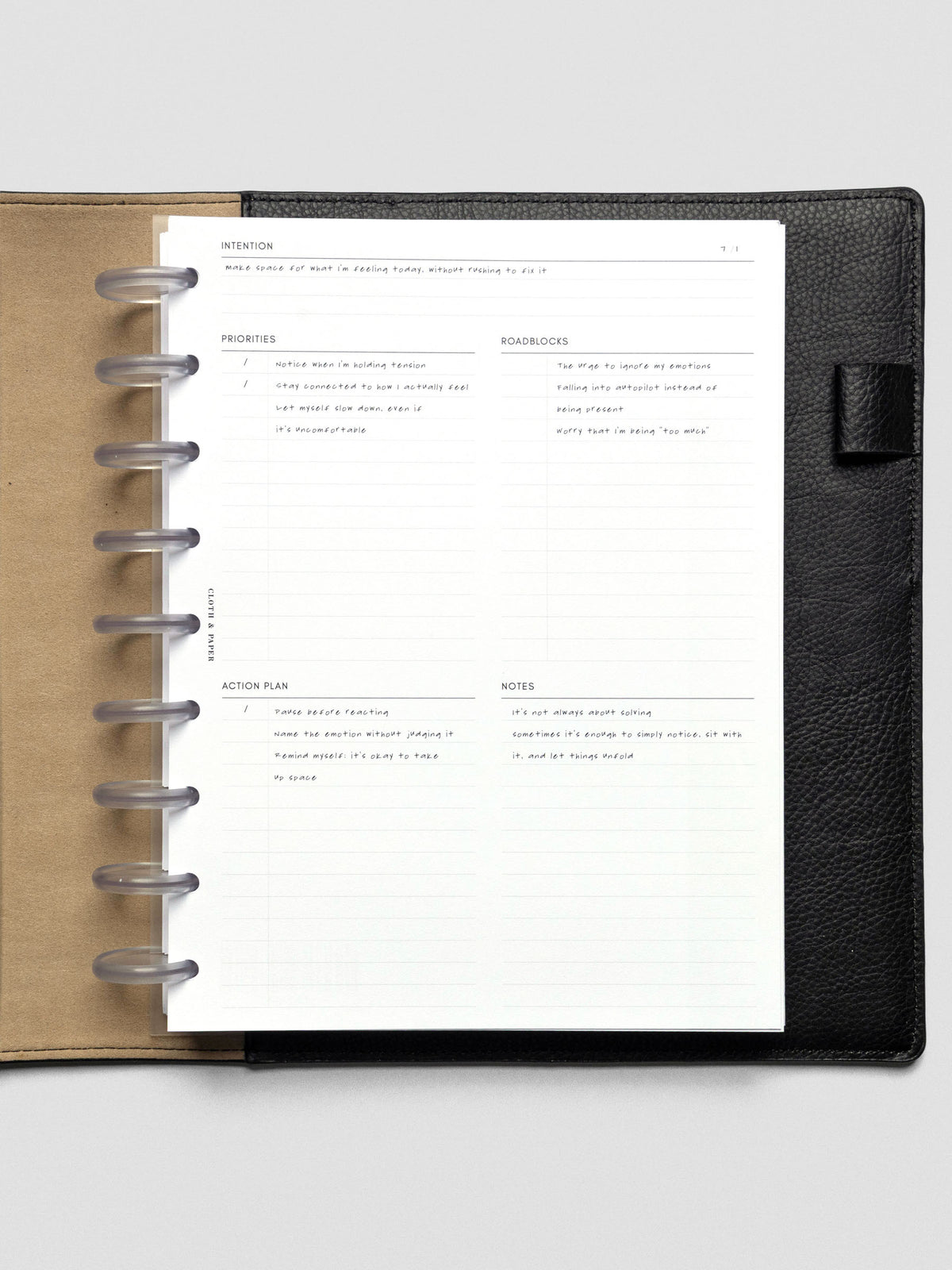 Daily Intention Planner Inserts show filled out in HP Classic size disc bound in a leather cover.