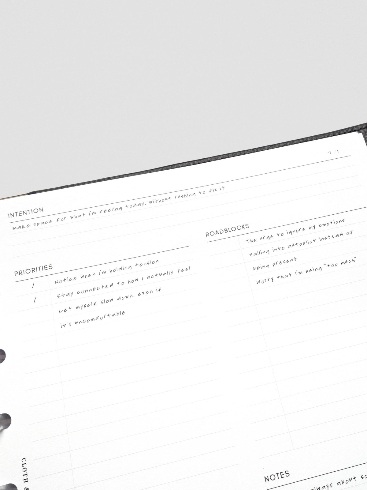 Close up of the Daily intention Planner Inserts showing the header and sections for Intention, Priorities, and Roadblocks with example text filled in on the theme of making space for what I'm feeling today without trying to fix it.