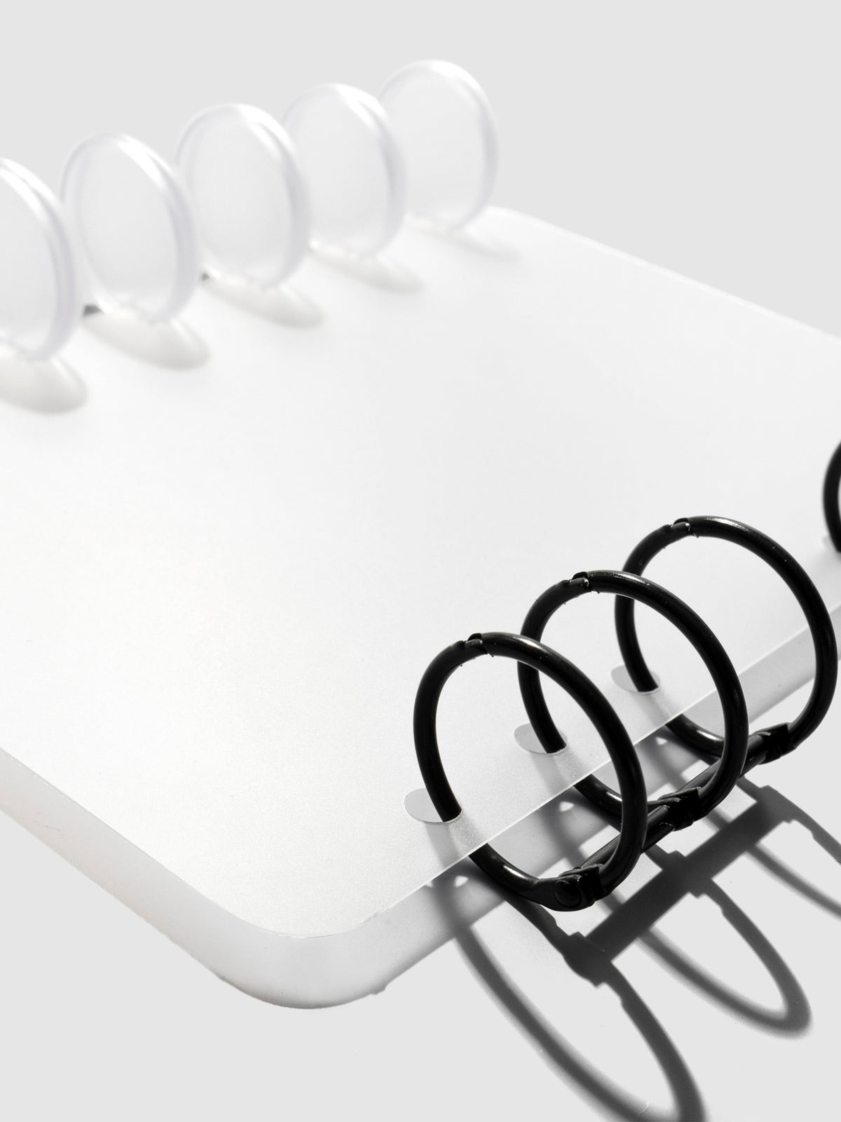 HP Mini / Personal cover displayed on a neutral background. It is shown filled with a set of clear planner discs and black planner rings.