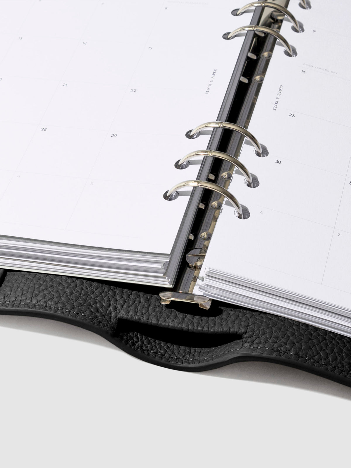 Close-up of the black leather agenda ring mechanism.