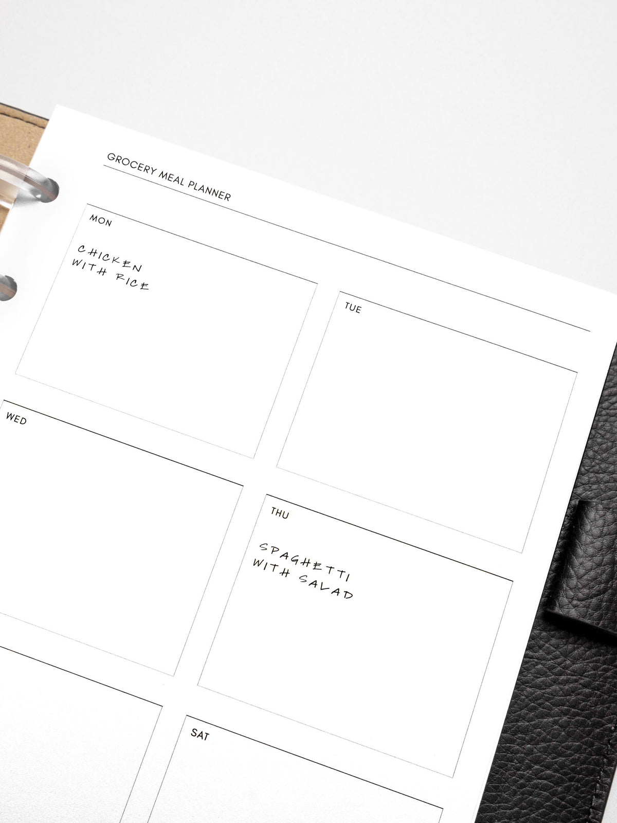 Closeup of a Grocery Meal Planner Insert inside a planner.