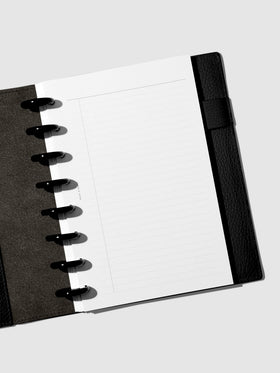 Half Letter planner in a black leather folio with black discs and task planner inserts.