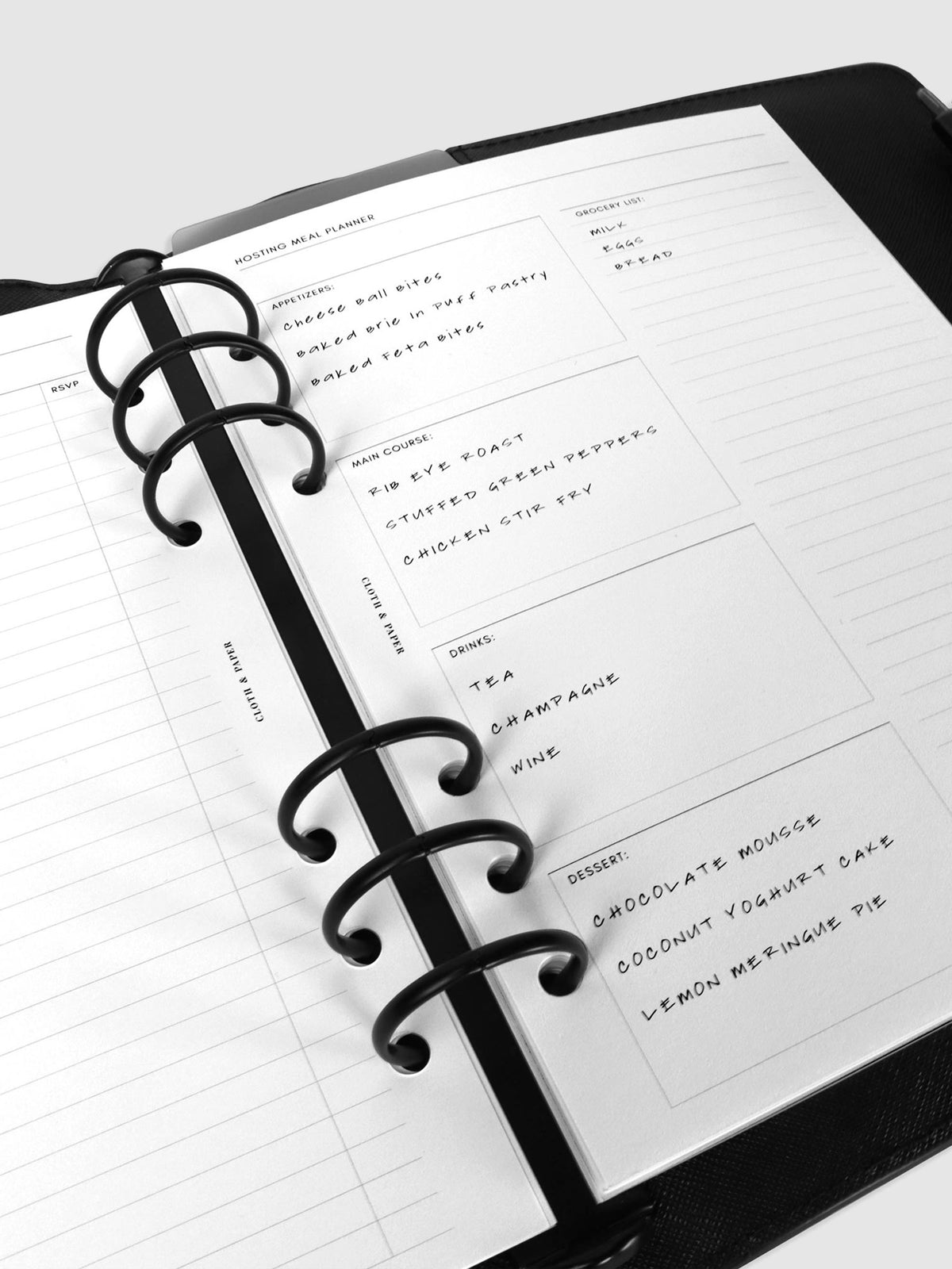 Inserts in use inside a black leather agenda.
