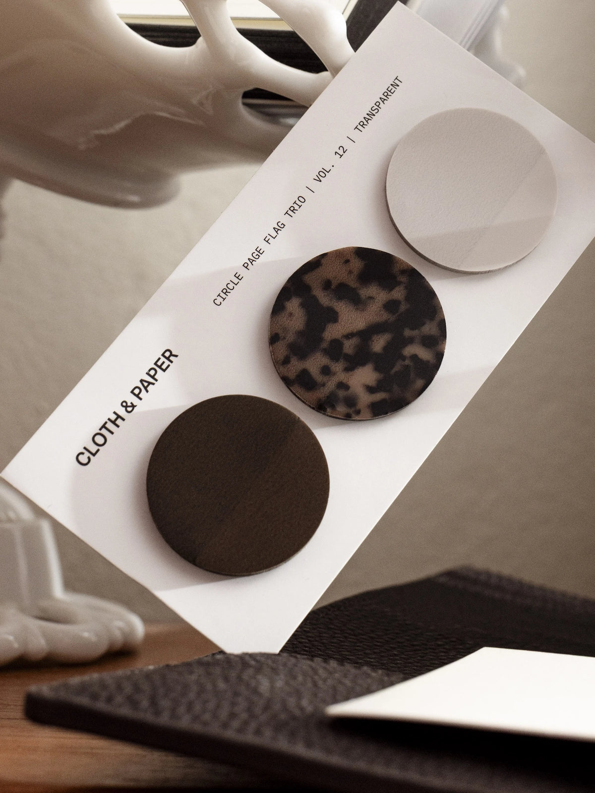 Circle Page Flag Trio | Walnut, Desert Tortoiseshell, Ibiza on a backing card.