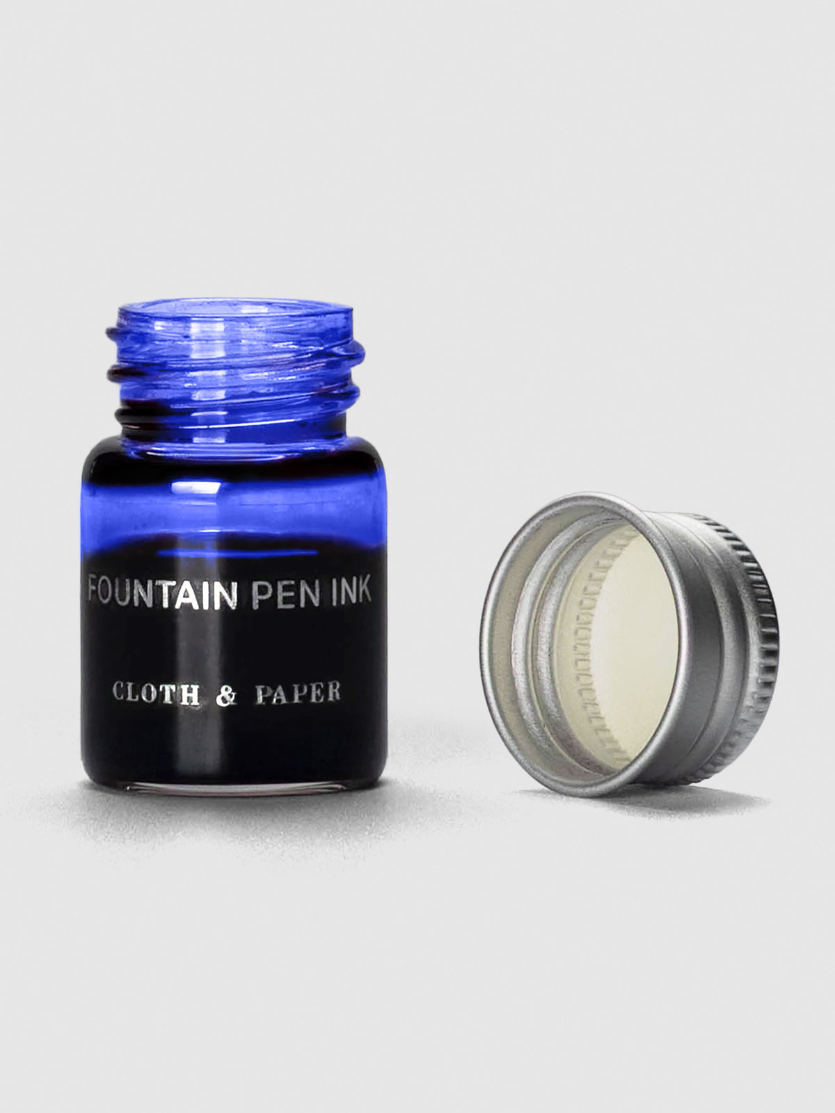 Indigo Mini Fountain Pen Ink shown with cap off bottle.