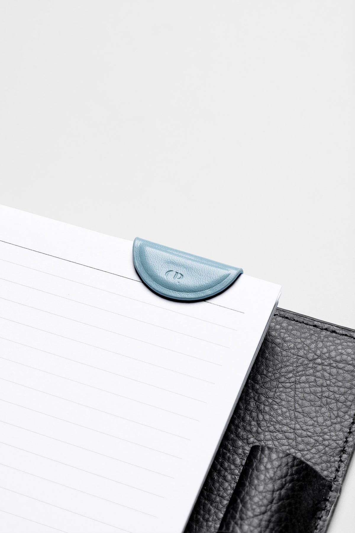 Mini Magnetic Bookmark in the color Smoked Salt attached to the inside of a planner.