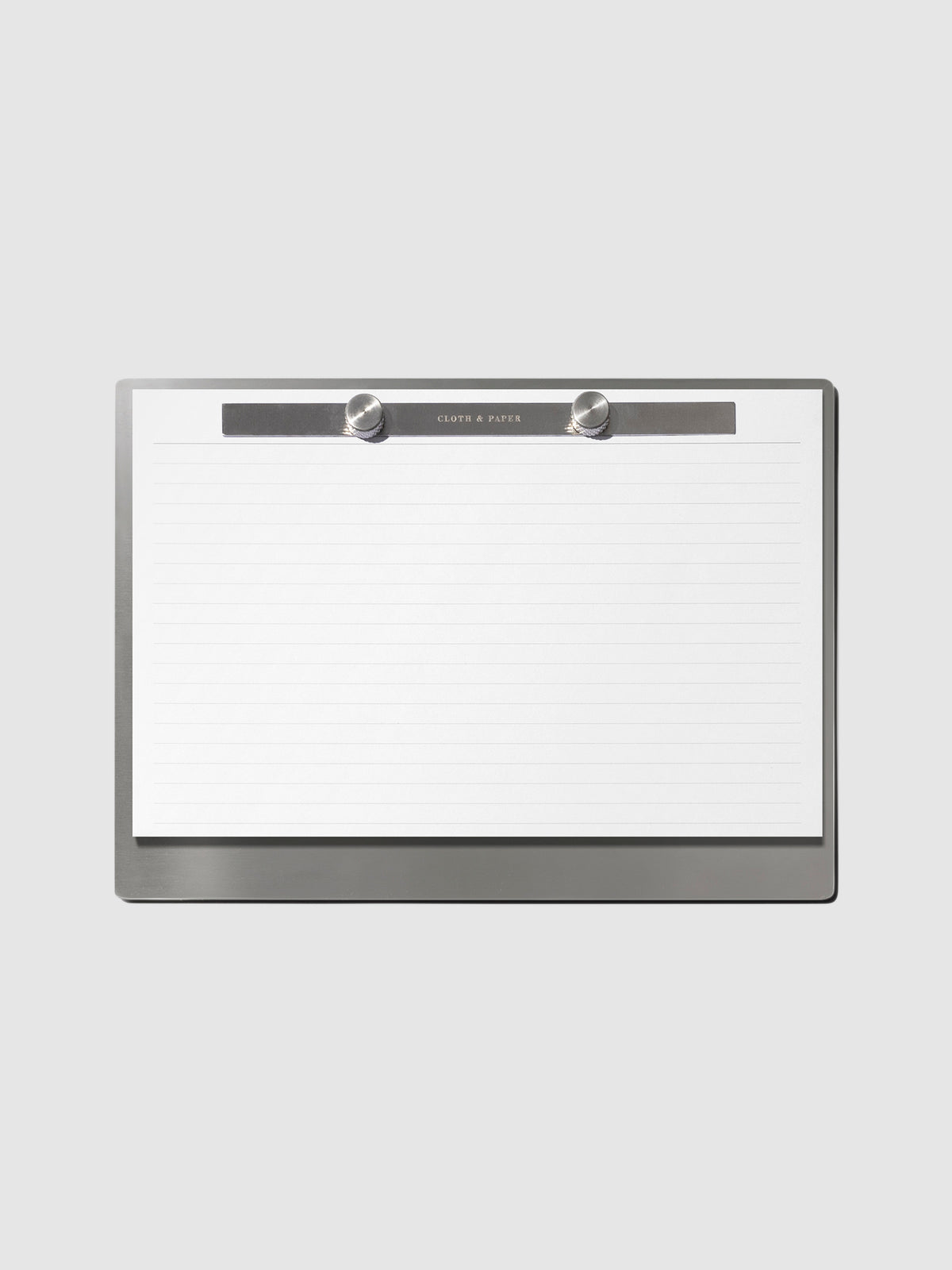 Modern Bound Notepad Insert Refills, lined, filled on the Modern Bound Notepad board, resting on a light neutral background