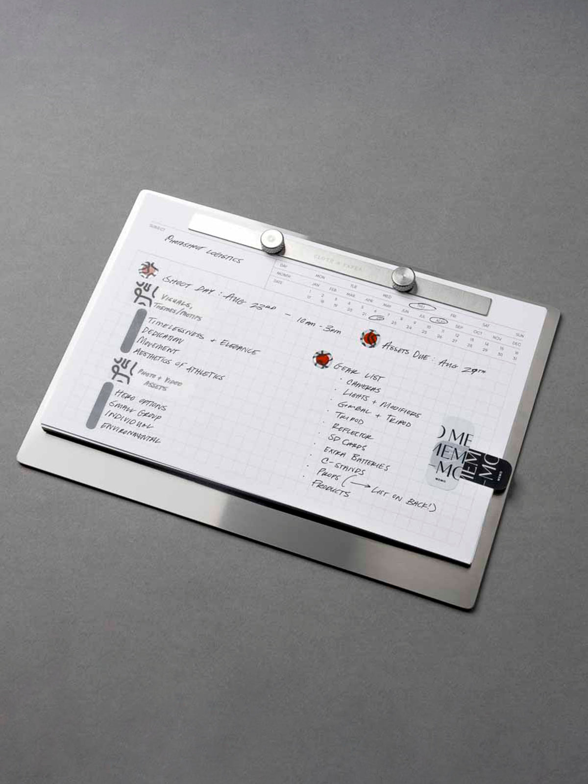 Modern Bound Notepad Insert Refills, executive notes, filled on the Modern Bound Notepad board. The inserts are filled with notes and stickers, showing them in use, resting on a gray table, angled to the left