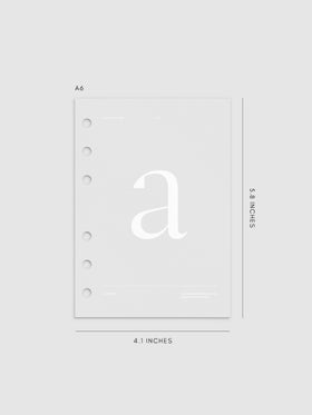 Monogram Vellum Planner Dashboard A in A6 displayed on a neutral background. 
