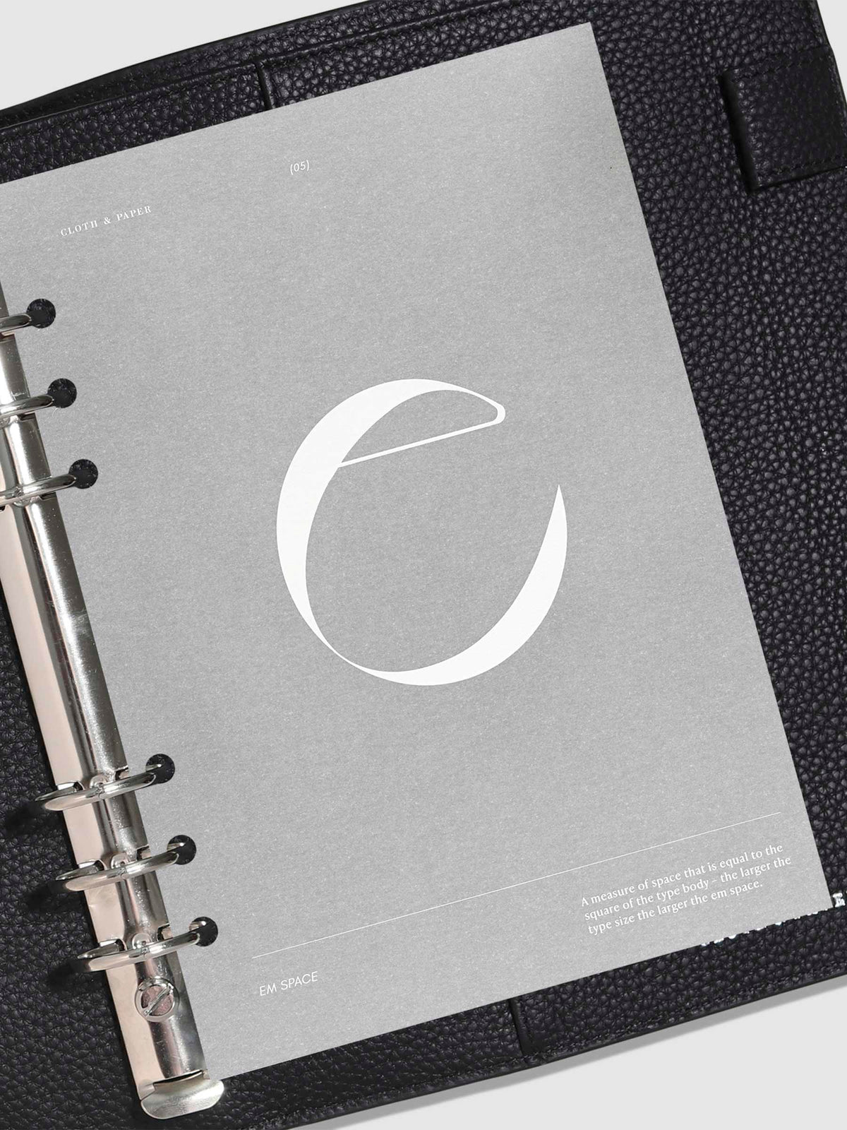 Monogram Vellum Planner Dashboard E in use in a leather planner.