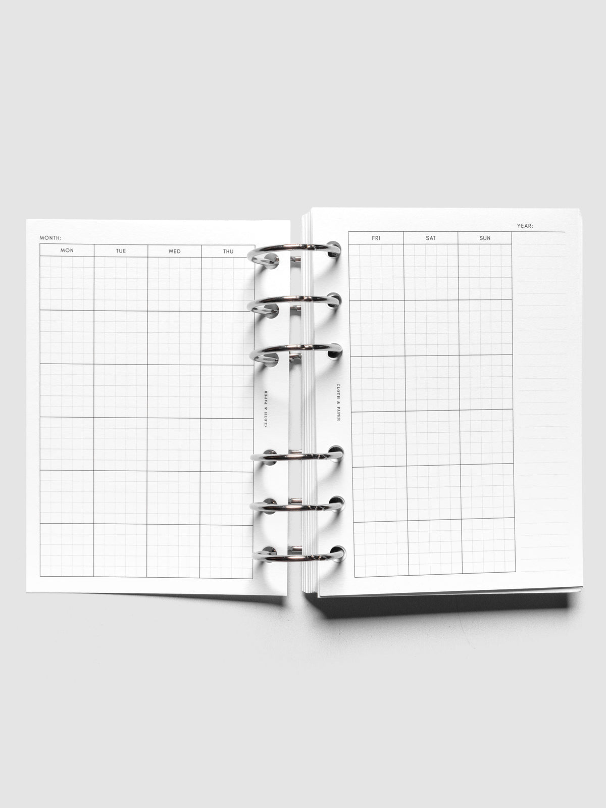 Personal Wide Monthly Graph Planner Inserts shown ringbound.