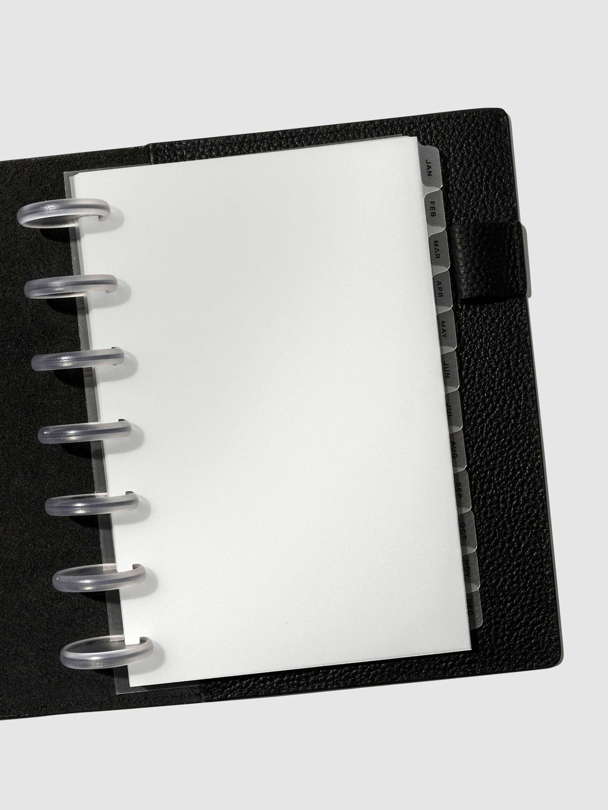 Black foil tabs displayed in use inside a black leather folio.