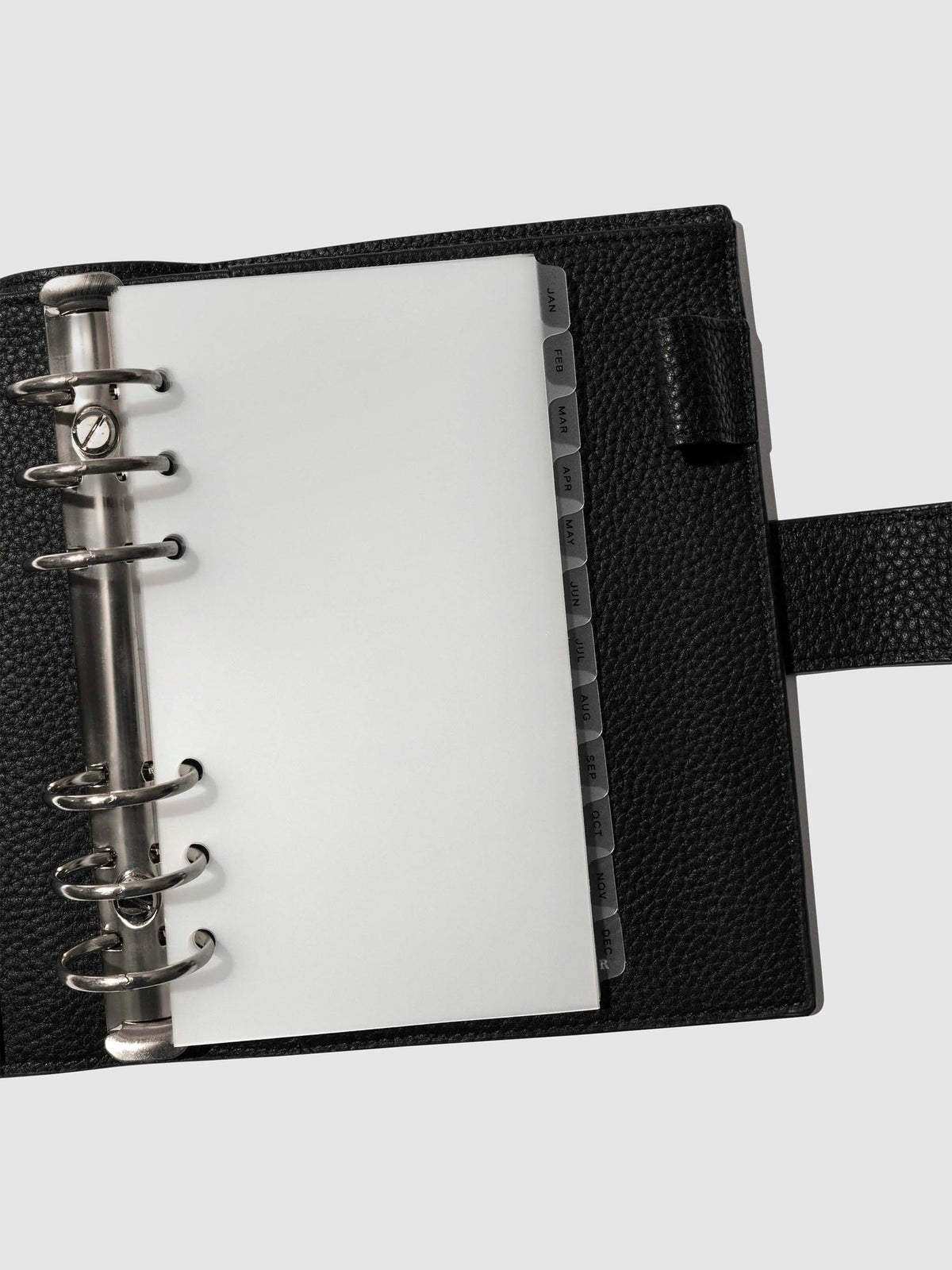Black foil tabs displayed in use inside a black leather folio.