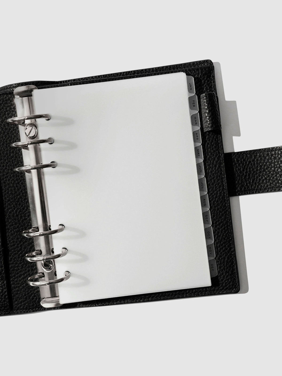 Black foil tabs displayed in use inside a black leather folio.
