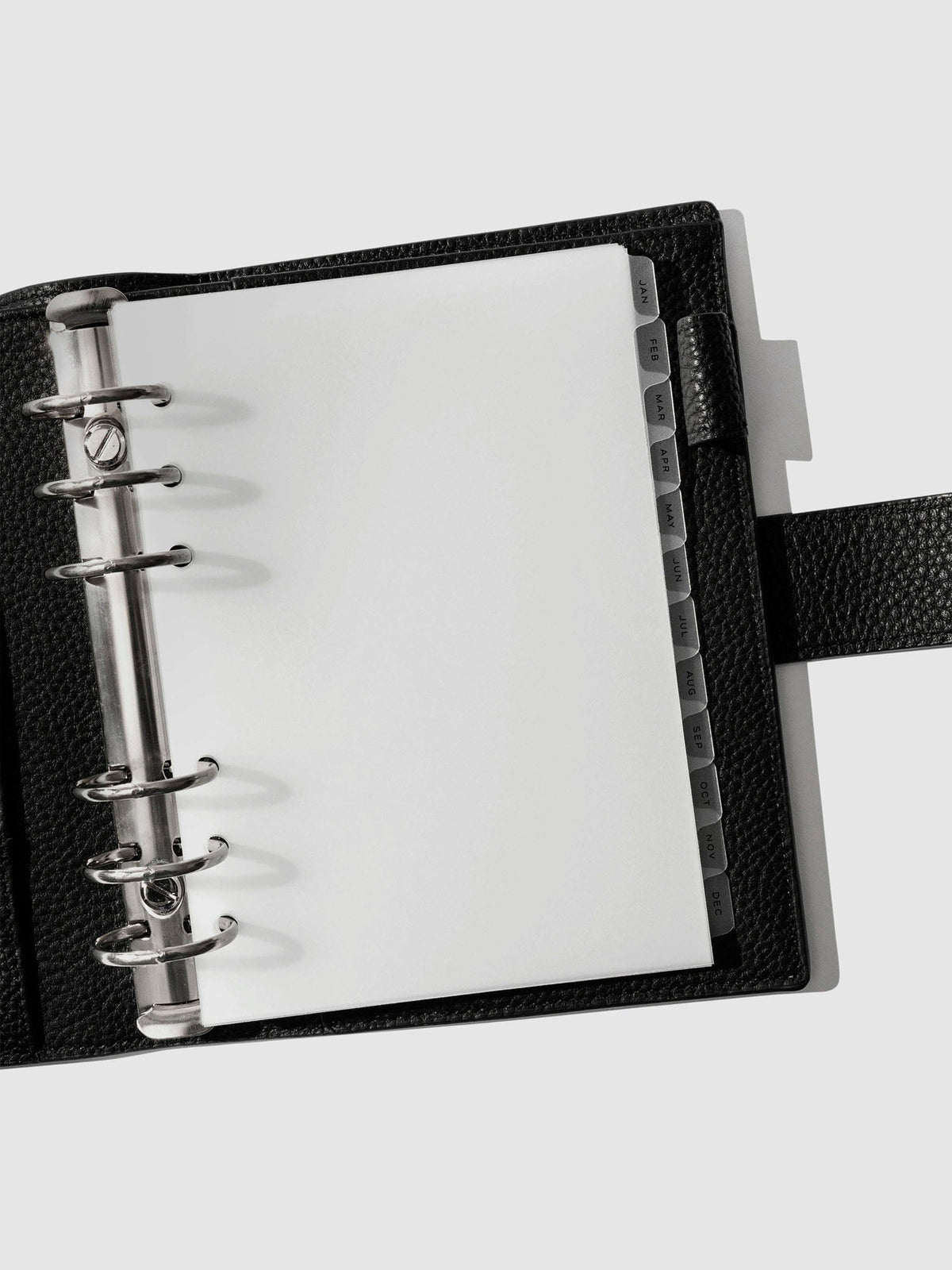 Black foil tabs displayed in use inside a black leather folio.