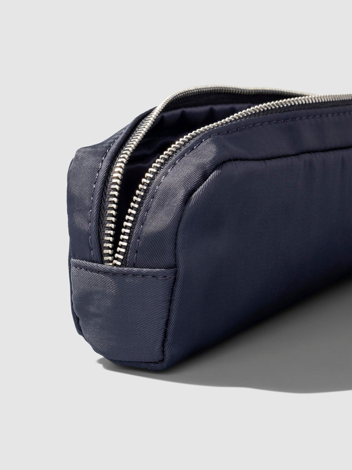 Closeup of pencil pouch's zipper. Color featured is Apollo.