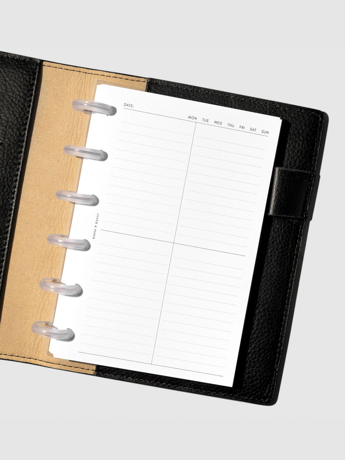 Insert in use inside a black leather planner.