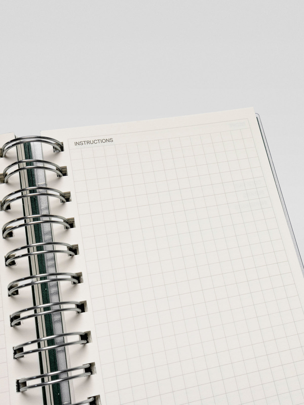 Close-up of the opposite recipe page in the Recipe Book System, with a grid section labeled "Instructions" for writing cooking directions.
