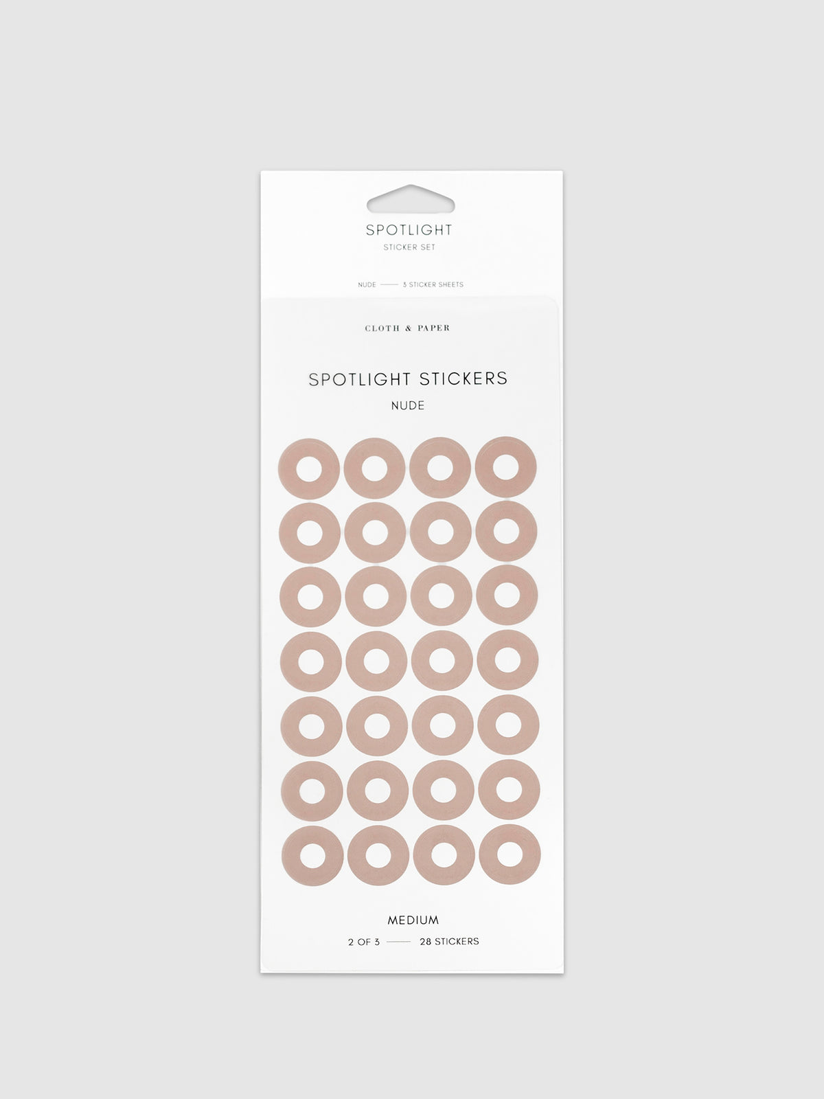 Medium sticker in its packaging displayed on a neutral background. Pictured color is nude.