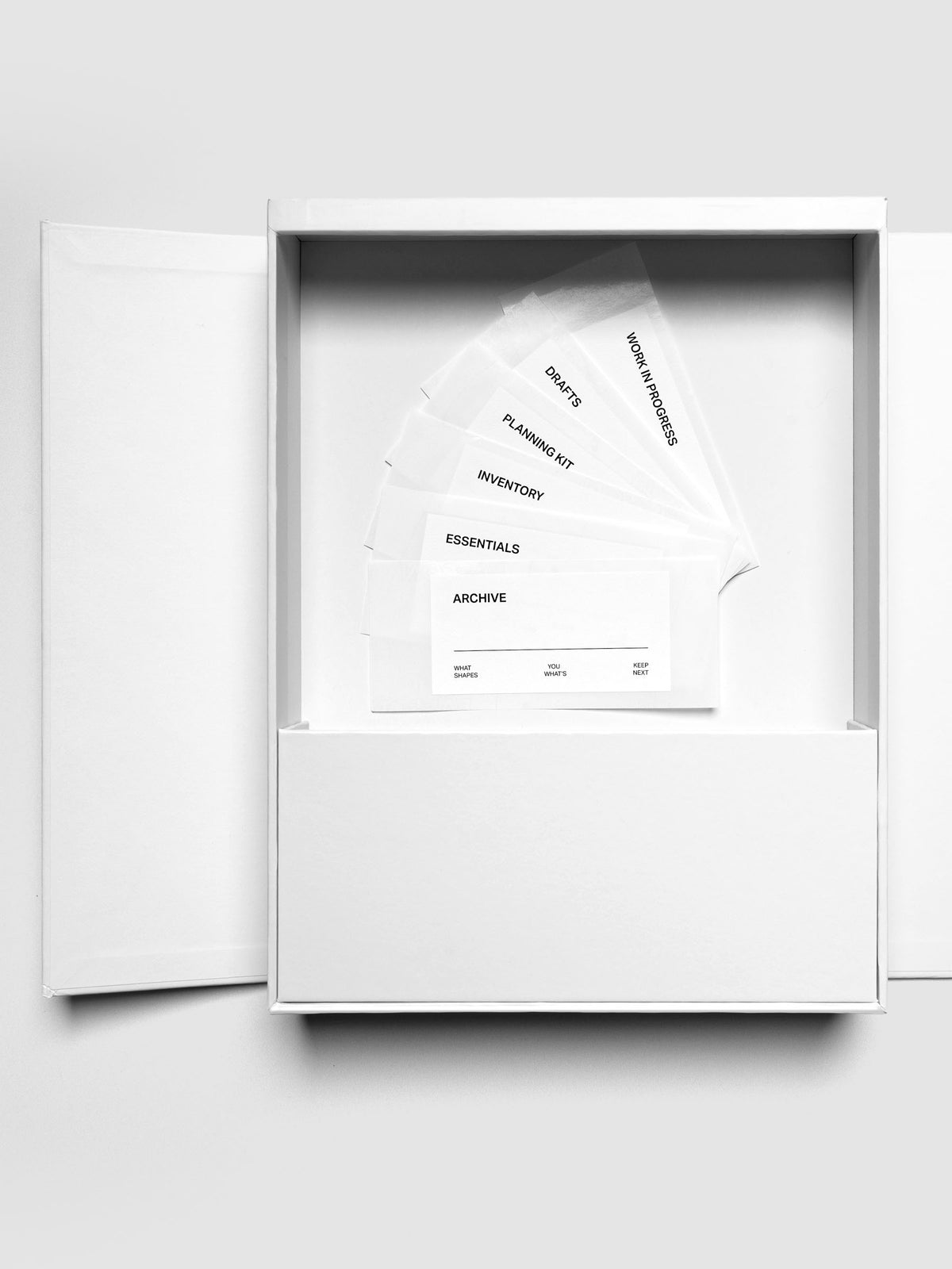 Storage Book 4.0 displaying left hand side with one large open compartment and labels resting inside.